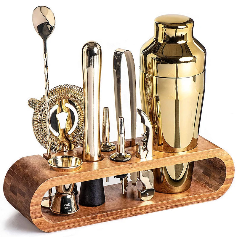 Set of gold and silver bar tools on a wooden stand against a white background