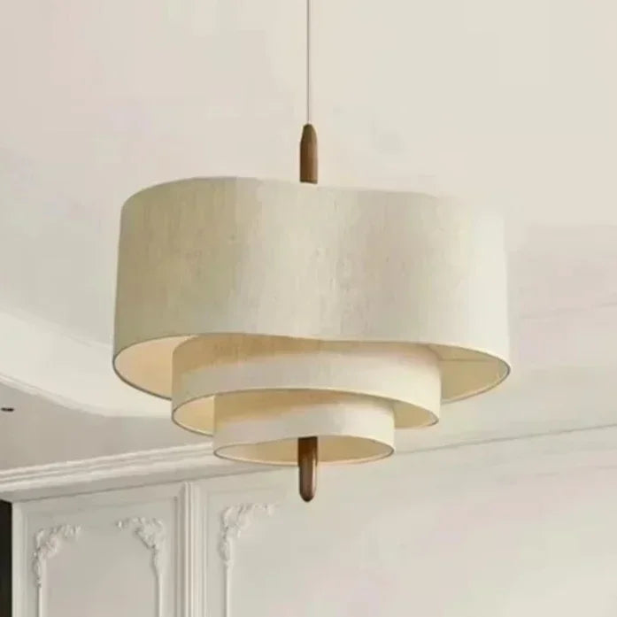 Modern pendant light with white and gold design in a room setting
